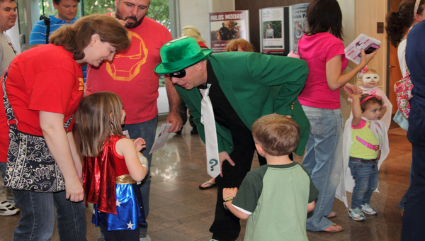 Children met both superheroes and villains during the summer kick-off party.